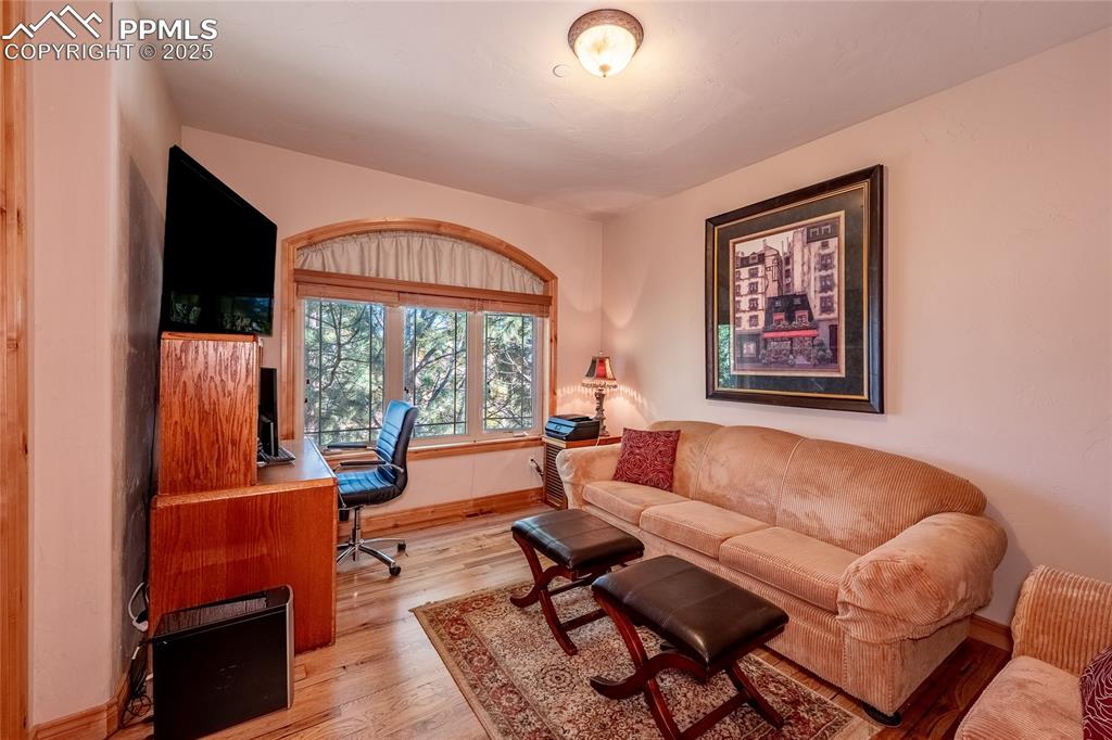 Image 31 of 47: Office area with light wood-style flooring.