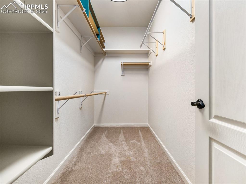 Image 21 of 25: Primary Walk-in Closet