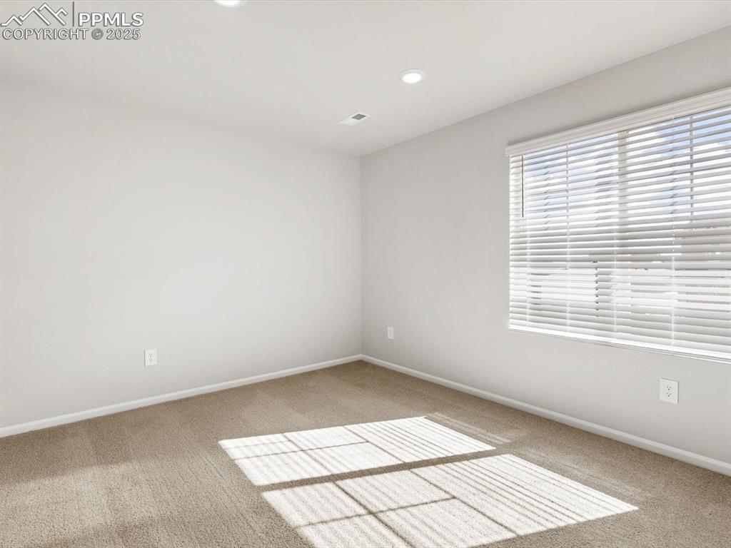 Image 21 of 23: Unfurnished room featuring carpet floors and recessed lighting