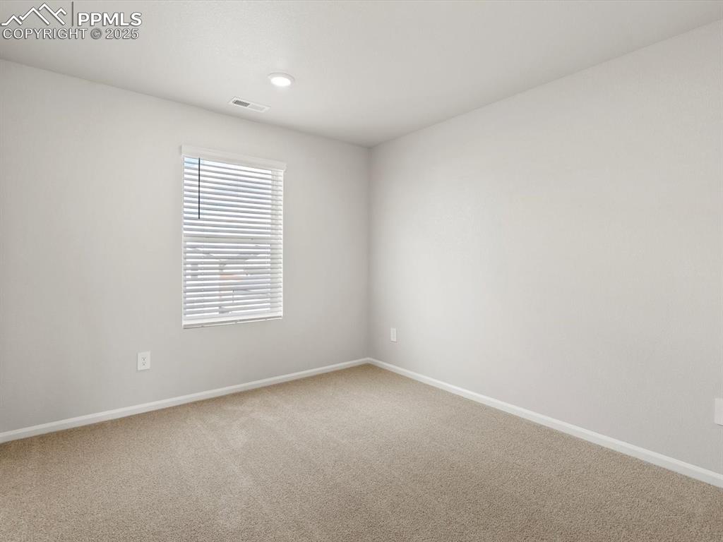 Image 22 of 23: Spare room with carpet flooring and recessed lighting