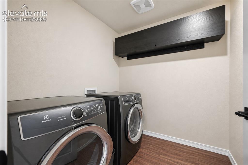 Image 22 of 28: second floor laundry room with additional storage