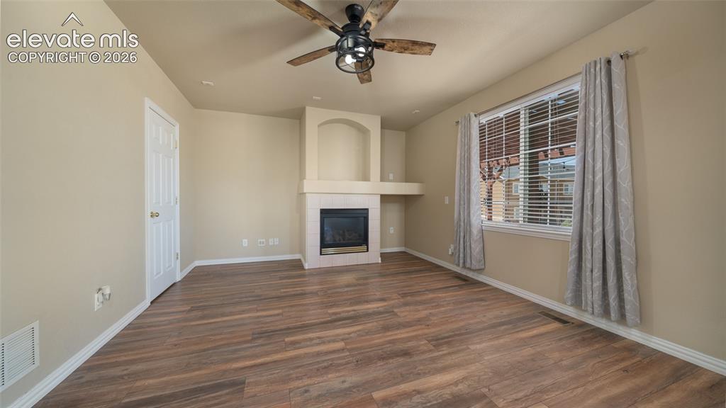 Image 15 of 47: Family room, LVP, fireplace
