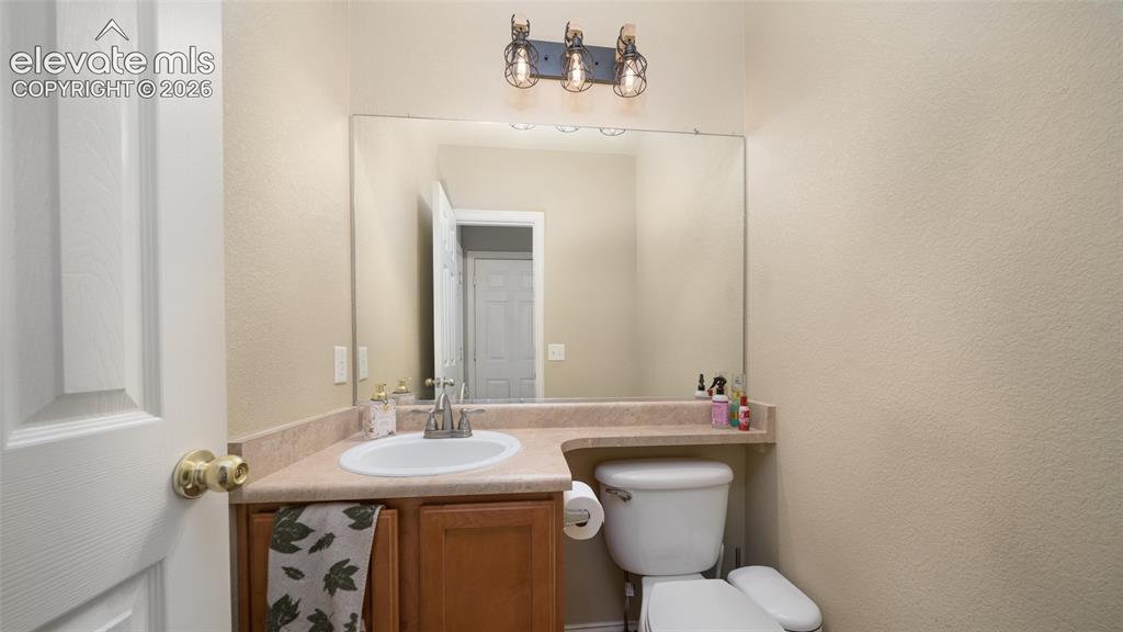 Image 17 of 47: Main level powder room