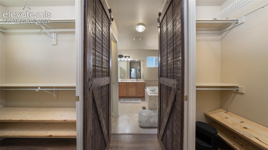 Image 22 of 47: Double master closets