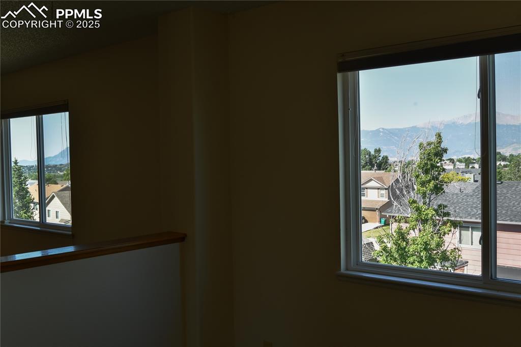 Image 31 of 48: Unfurnished room with a mountain view