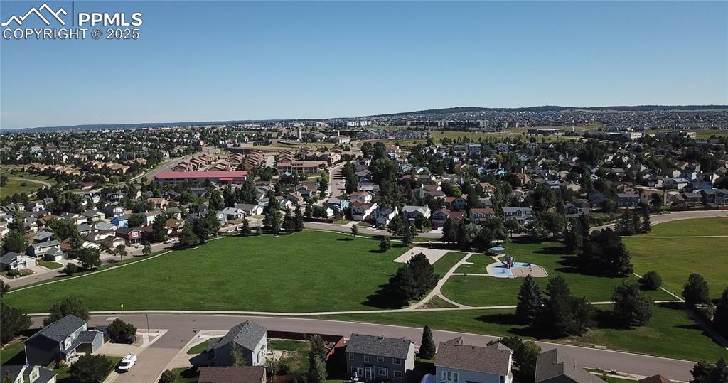 Image 4 of 48: Aerial view of property and surrounding area with nearby suburban area