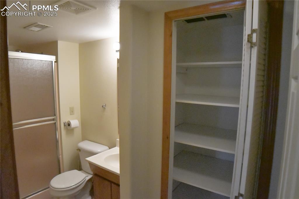 Image 41 of 48: Full bath with vanity and a shower stall