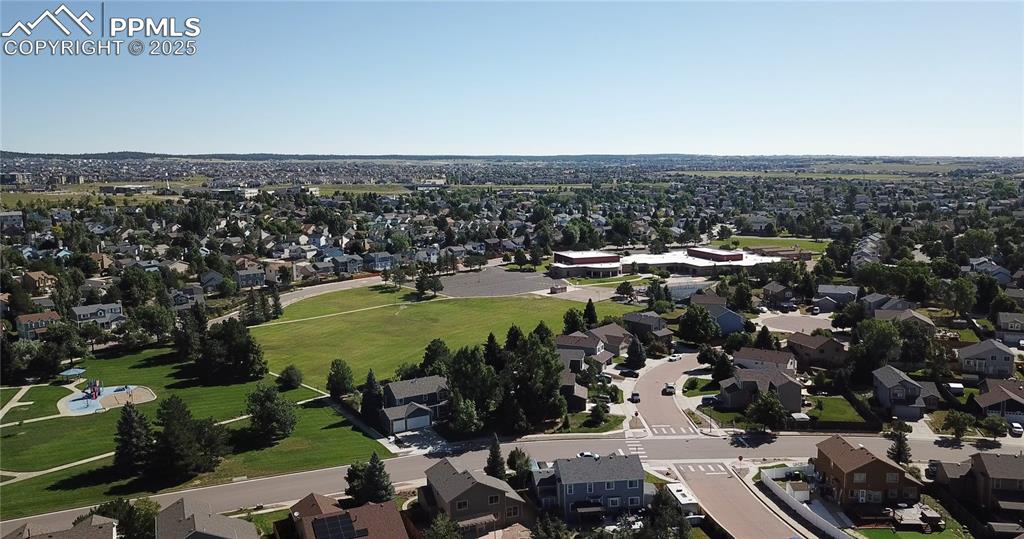 Image 5 of 48: Aerial view of property and surrounding area featuring nearby suburban area