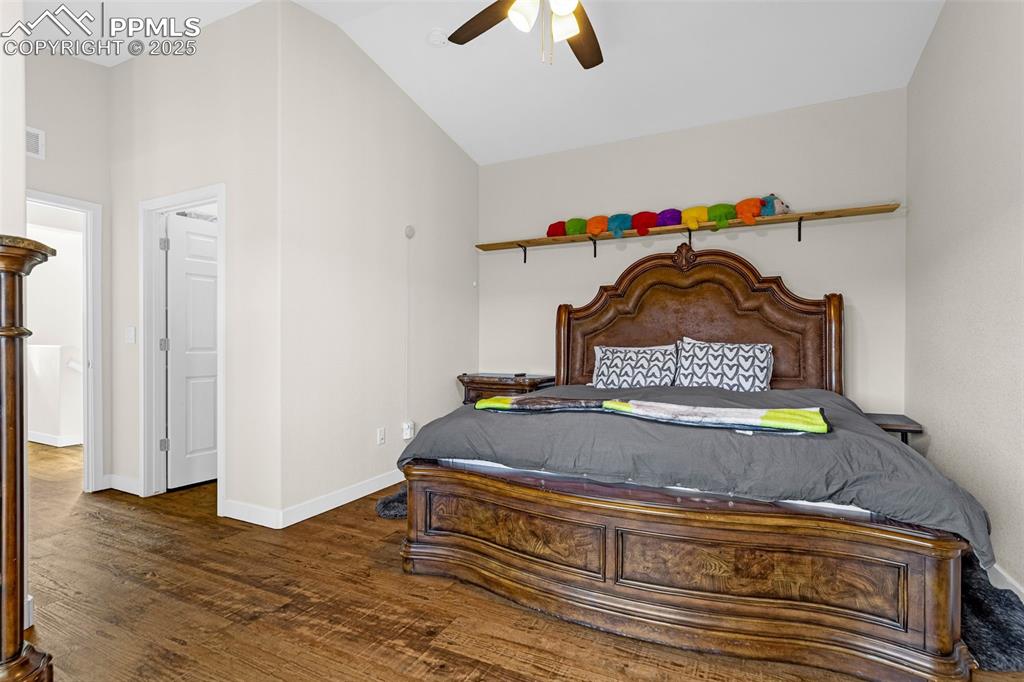 Image 13 of 37: Spacious primary Bedroom with a ceiling fan, engineered hardwood floor, wal