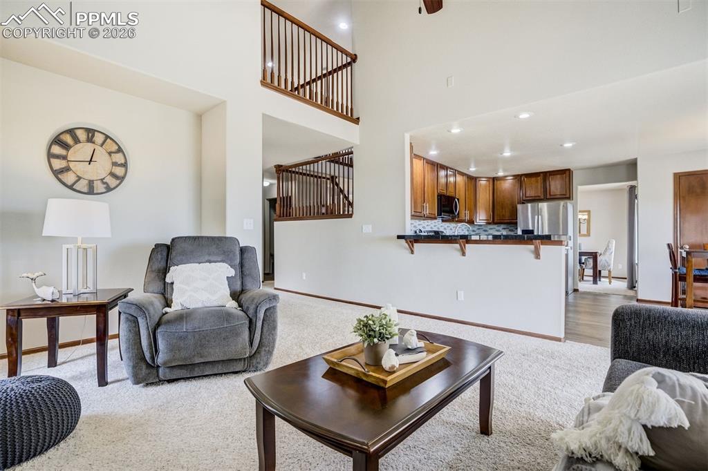 Image 18 of 45: The kitchen is open to the family room, keeping the conversation going whil