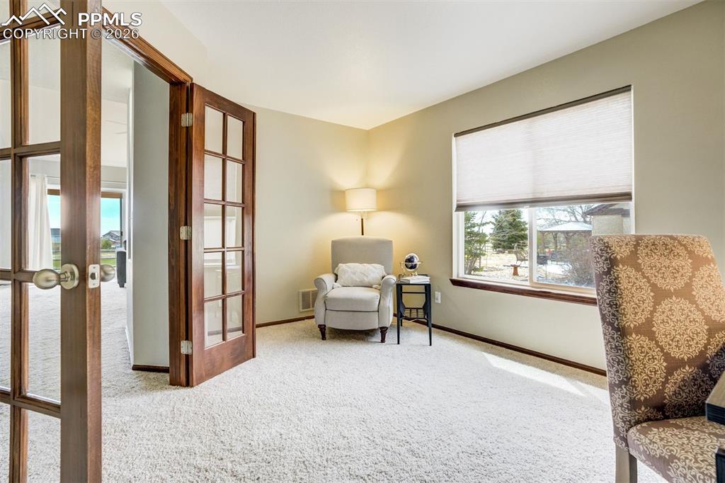 Image 21 of 45: Family room is spacious & bright with vaulted ceiling open to the landing a