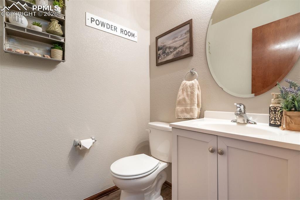 Image 23 of 45: From the family room, you can step out to enjoy the Colorado sky or take in