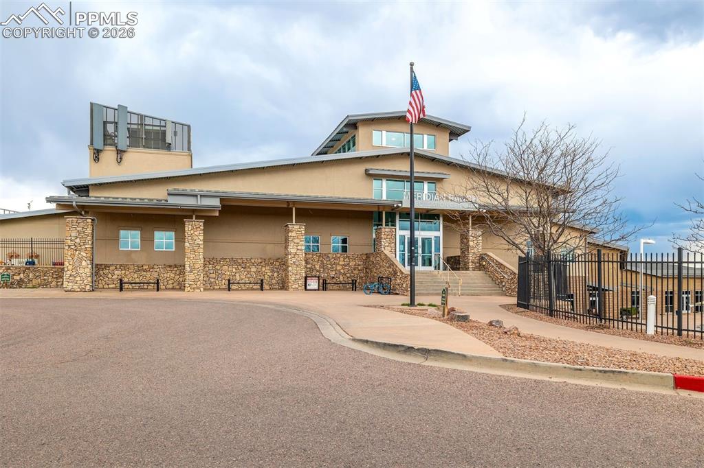 Image 41 of 45: Aerial view of the home, the xeric yard and the neighborhood beyond
