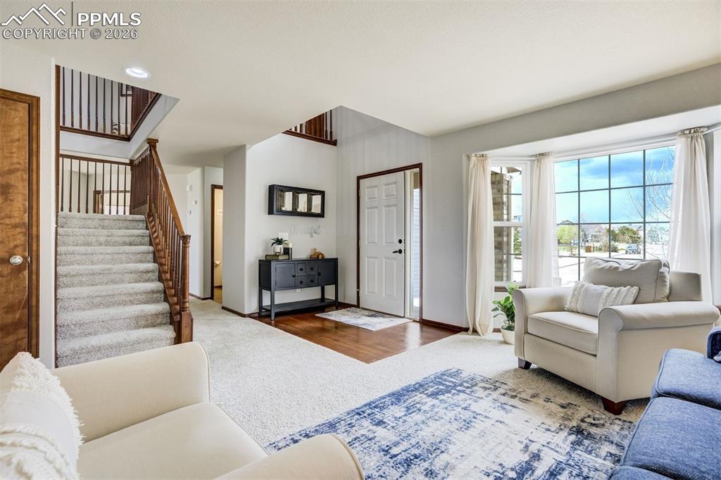 Image 7 of 45: Primary suite with vaulted ceiling & ceiling fan
