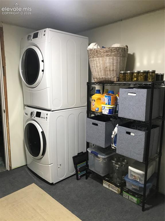 Image 20 of 30: Spacious laundry area with room for storage and folding