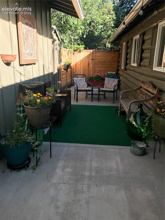 Image 24 of 30: private back patio area, great for a cozy BBQ and drinks with friends!