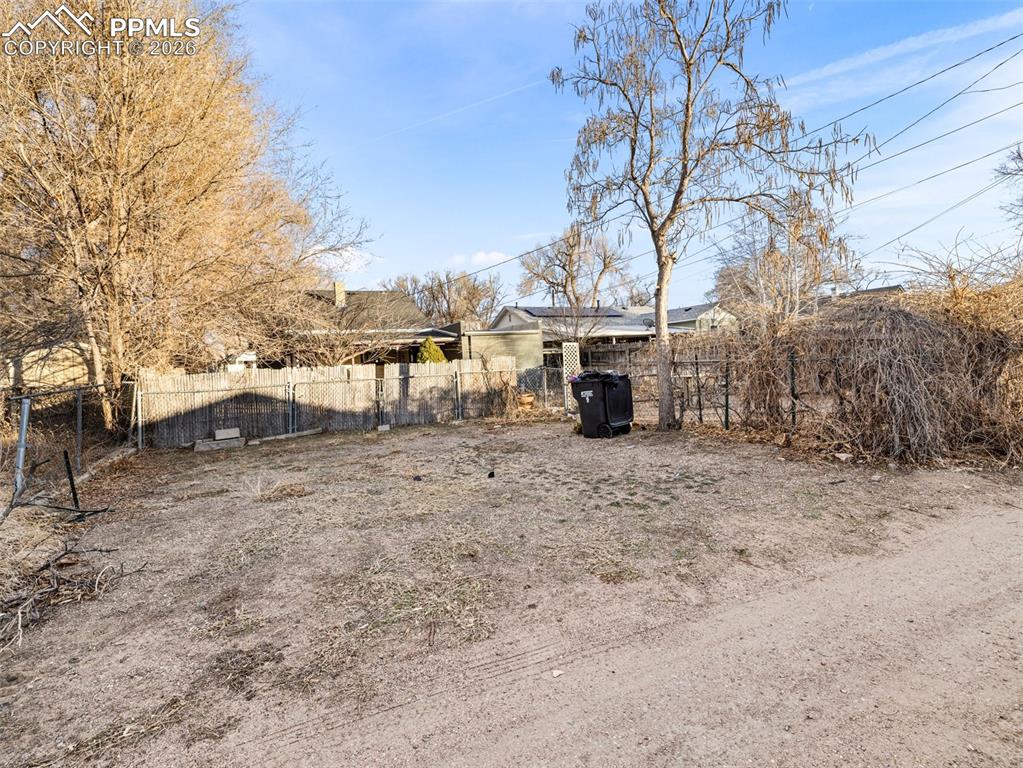 Image 19 of 25: Additional parking from alley