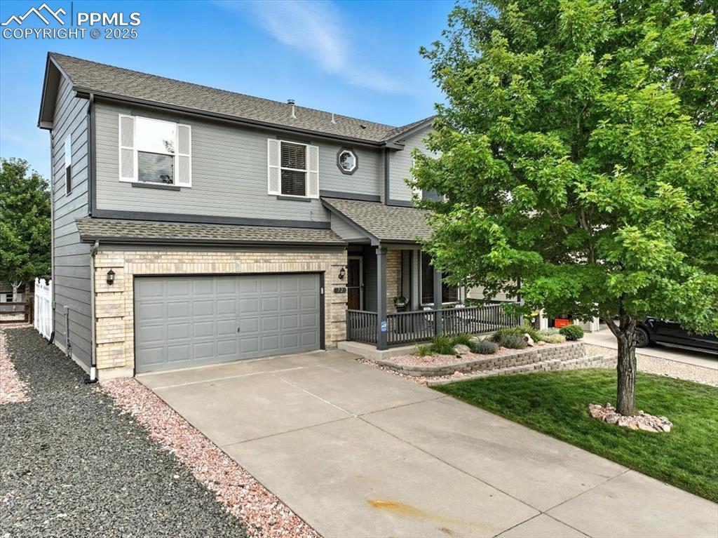 Caption: Front of  home features mature landscape and long driveway with immaculate landscaping