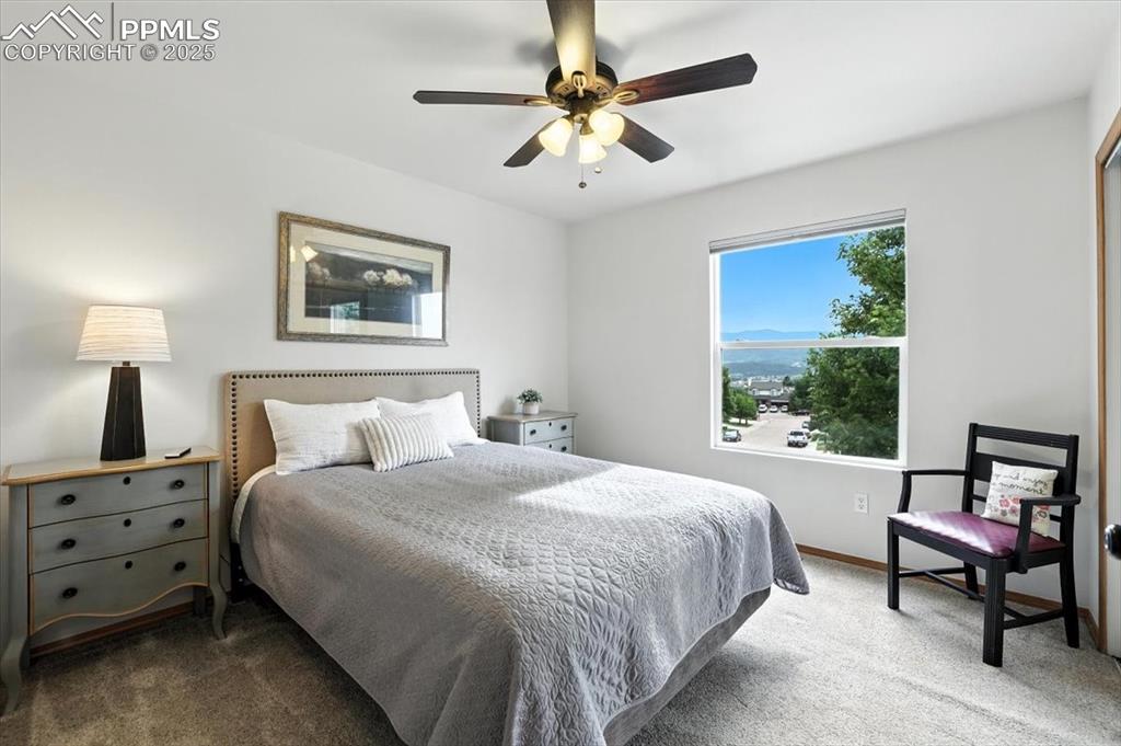Image 17 of 41: Second bedroom is west facing with beautiful mountain views.