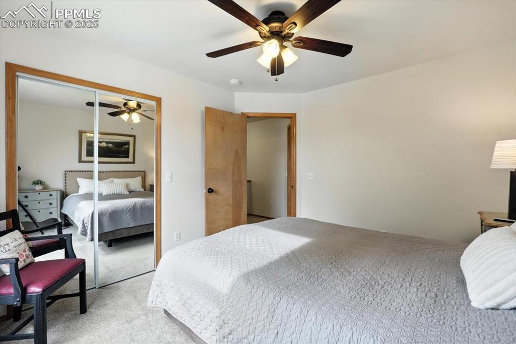 Image 18 of 41: Second bedroom is filled with light