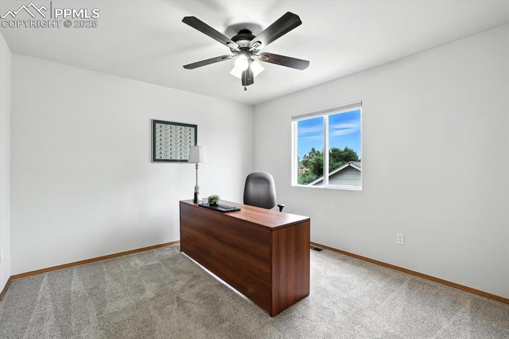 Image 19 of 41: Third bedroom is south facing and is currently used as an office