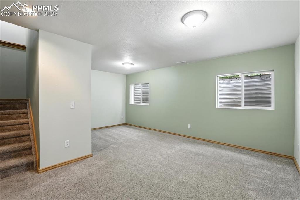 Image 24 of 41: Basement family room is ready for entertaining and has been updated