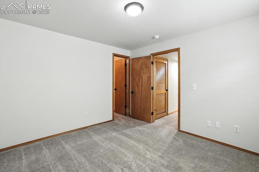 Image 29 of 41: Basement bedroom features large walk in closet