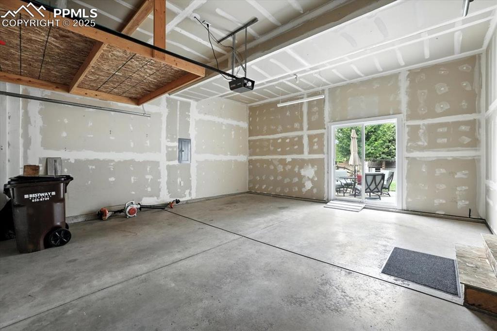 Image 32 of 41: Garage has easy access to back yard and loft storage