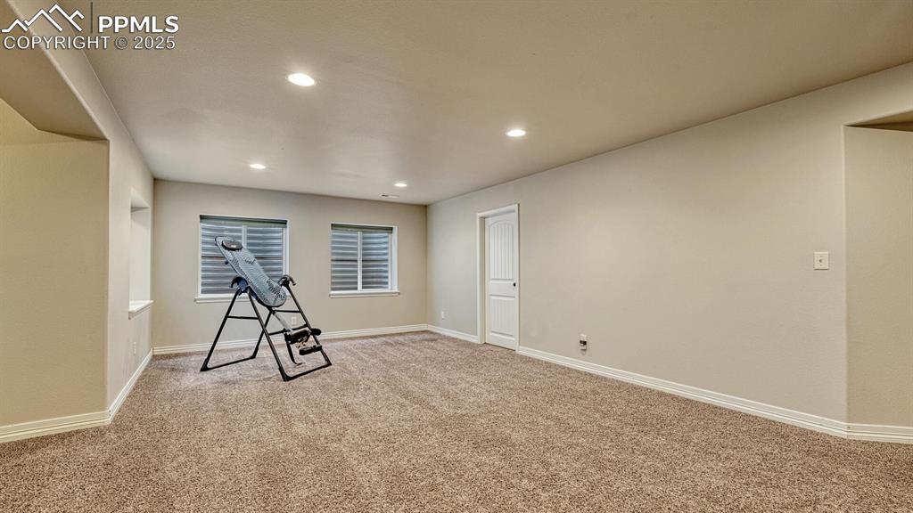Image 32 of 44: Exercise room with carpet flooring and recessed lighting