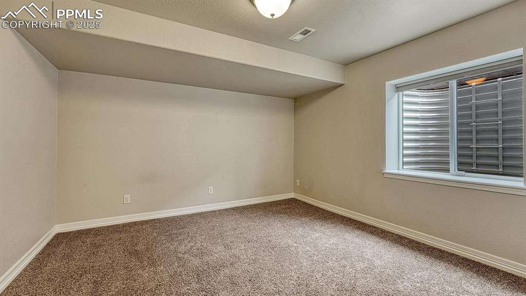 Image 34 of 44: Bonus room featuring carpet flooring and baseboards