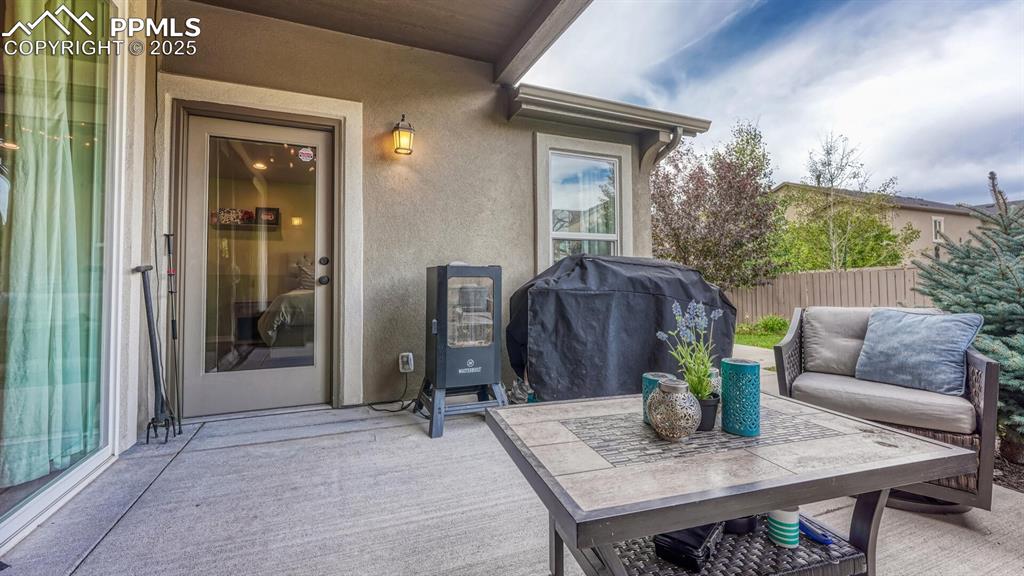 Image 41 of 44: View of patio featuring area for grilling