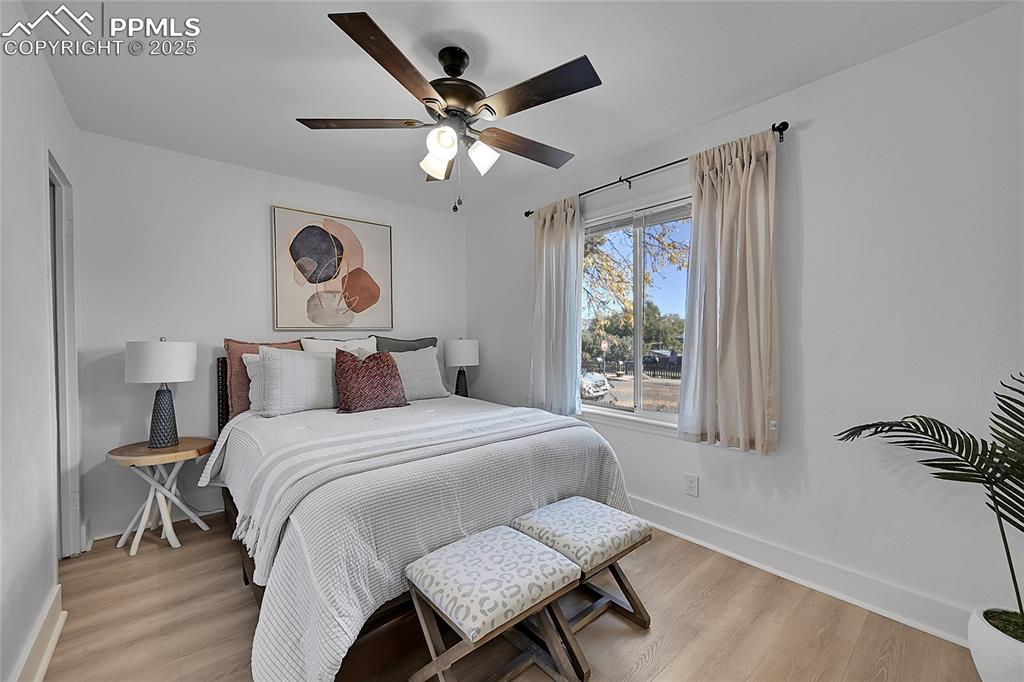 Image 20 of 47: East facing bedroom has beautiful morning sunlight and new paint, flooring 