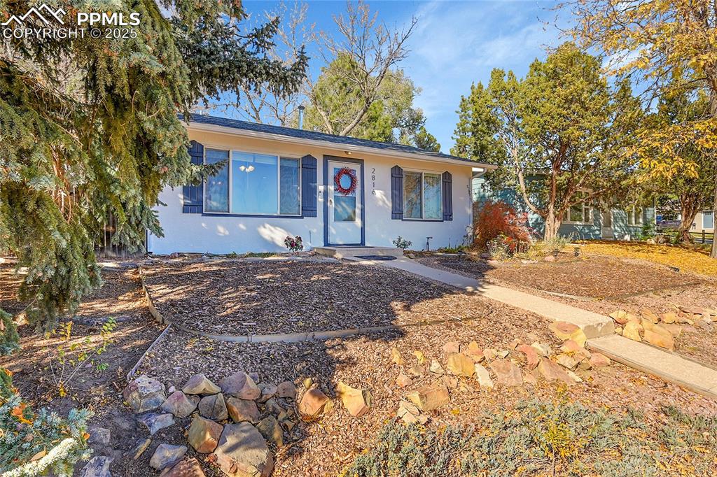 Image 3 of 47: SE view of ranch-style house featuring stucco siding
