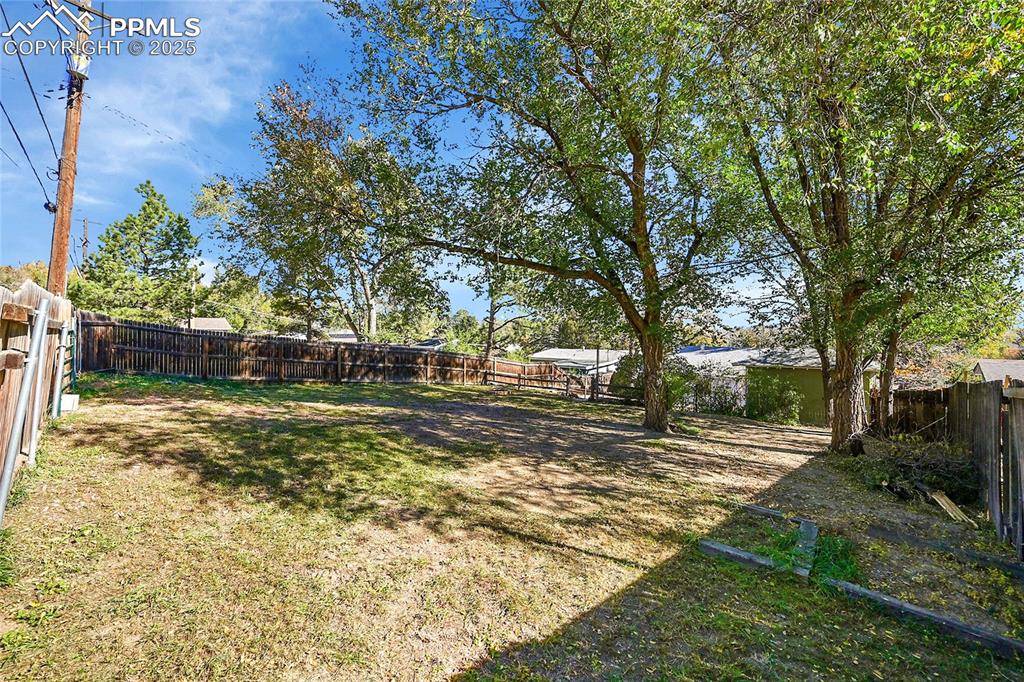 Image 39 of 47: Extra wide gate w/ alley access allows additional parking up top.