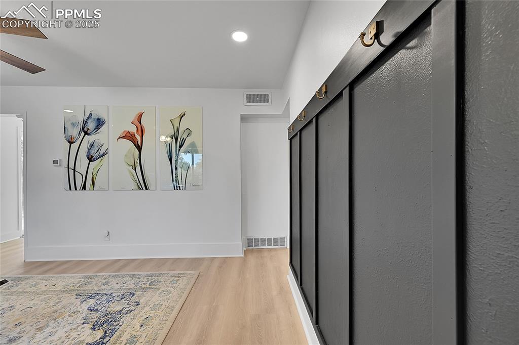 Image 4 of 47: Entryway with custom drop zone and recessed lighting