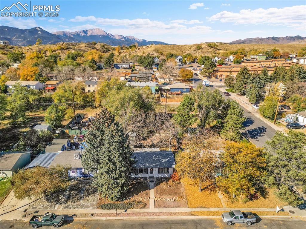 Image 44 of 47: Aerial view of neighborhood featuring a mountain backdrop