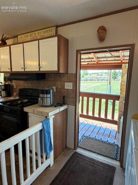 Image 14 of 39: Walk out to the covered patio