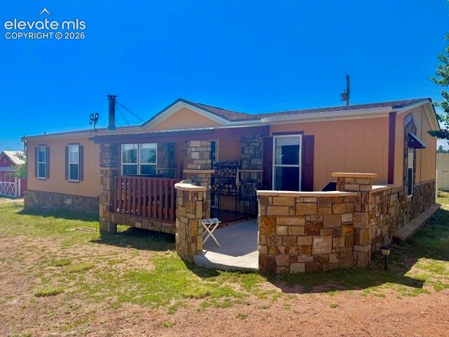 Image 2 of 39: Front of the home, great entertainment space