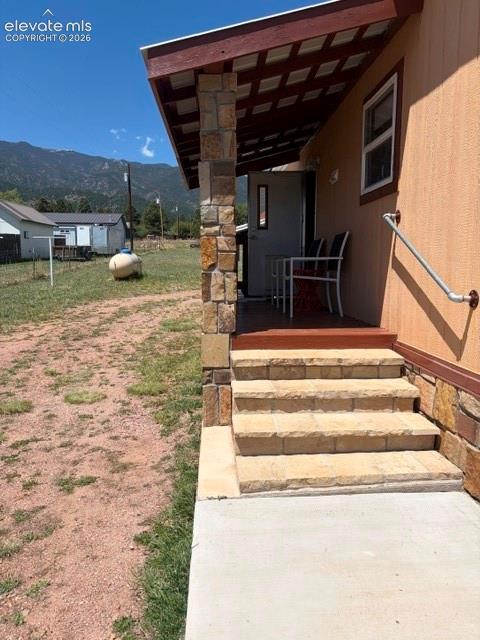 Image 37 of 39: Back Patio, stone steps and walk way