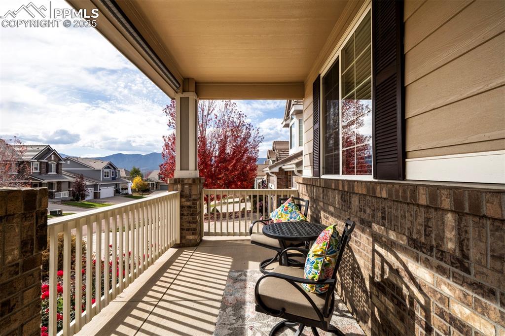 Image 4 of 38: Large covered front porch wiith view