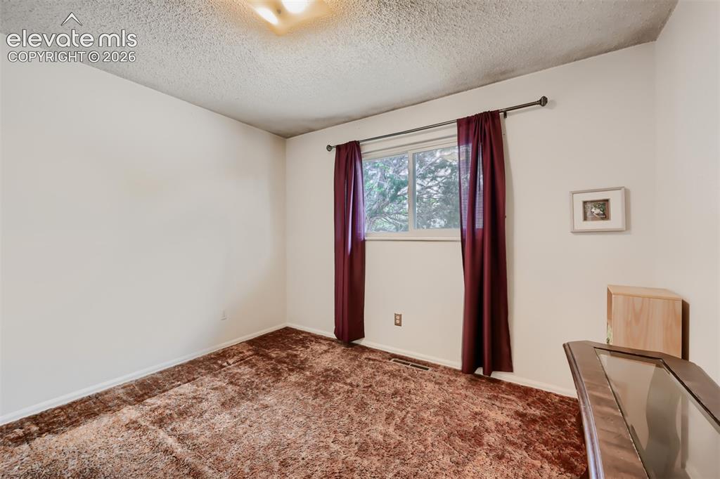 Image 14 of 28: Main floor bedroom