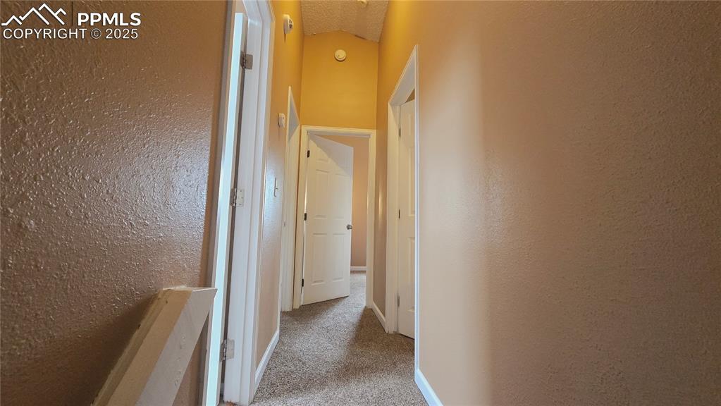 Image 13 of 42: Corridor to upper-level bedrooms and bathroom 
