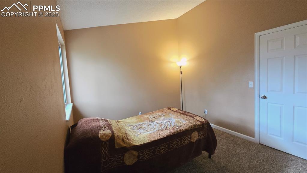 Image 21 of 42: Carpeted bedroom featuring baseboards