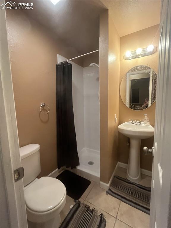 Image 28 of 42: 3/4 bathroom on lower-level