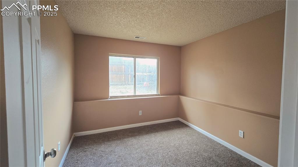 Image 36 of 42: Lower-level bedroom/office