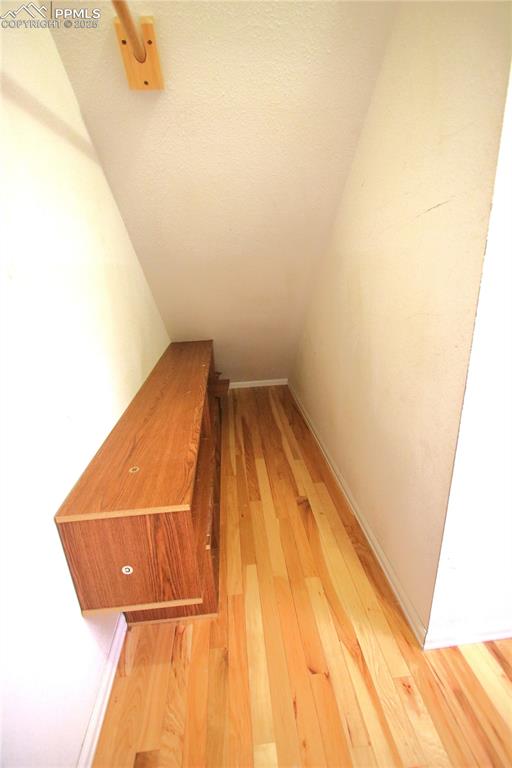 Image 24 of 49: Walk in closet in primary bedroom