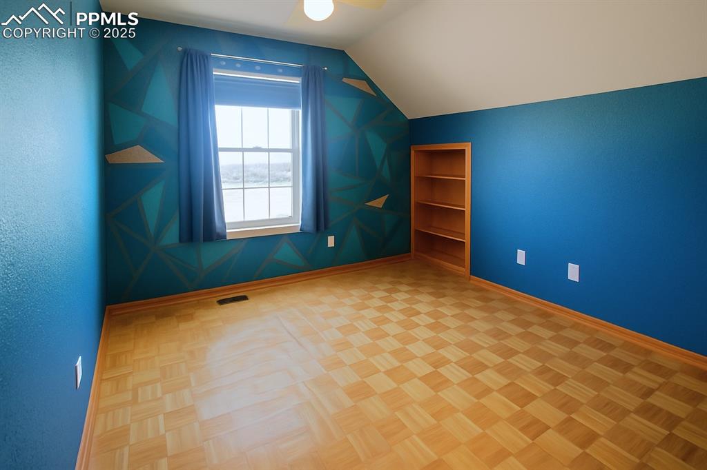 Image 29 of 49: #3 - hidden closet/storage behind the bookcase