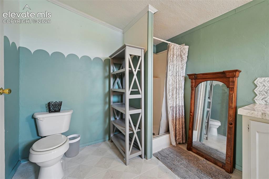 Image 11 of 49: Boast Stencil Tile Flooring, Garden Soaking Tub and Stand Alone Shower!