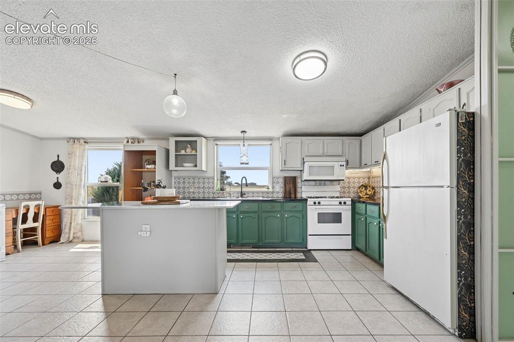 Image 22 of 49: Large Eat In Kitchen with Pantry Cabinet