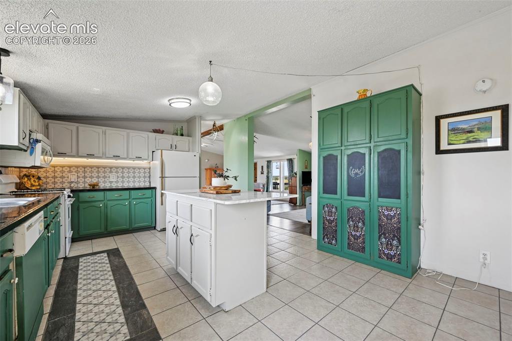 Image 24 of 49: Solid Counter Tops and Marble top island